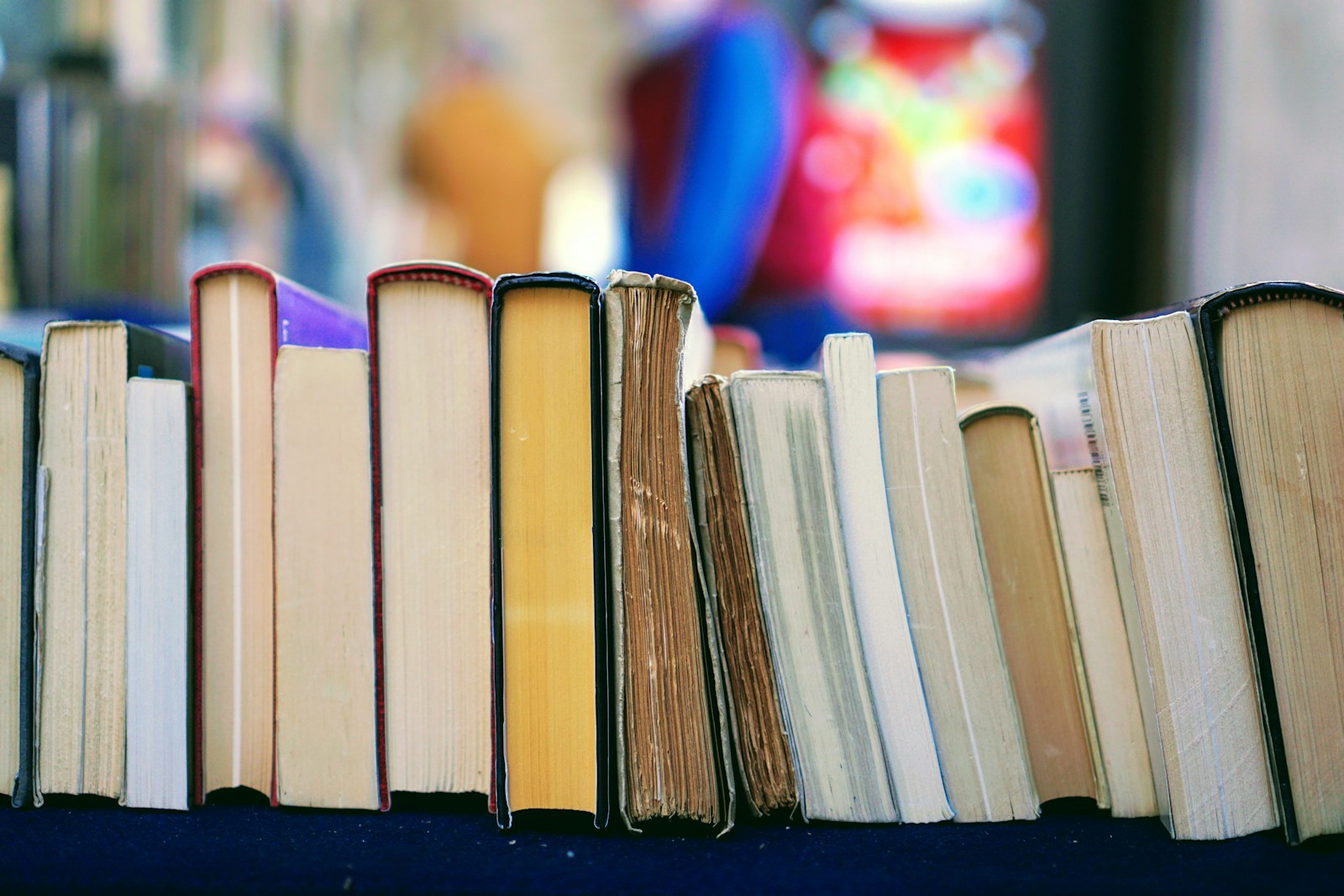 Worn books on a shelf